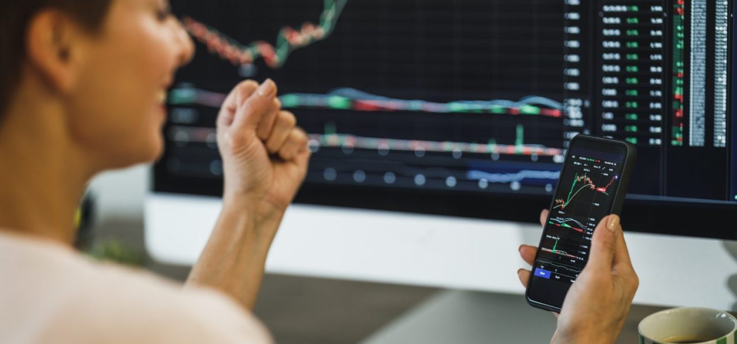woman-trading-with-cryptocurrency-and-celebrating-for-success.jpg
